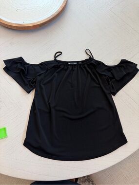 New York & Co cold shoulder black blouse. Size S. Ruffle detail.